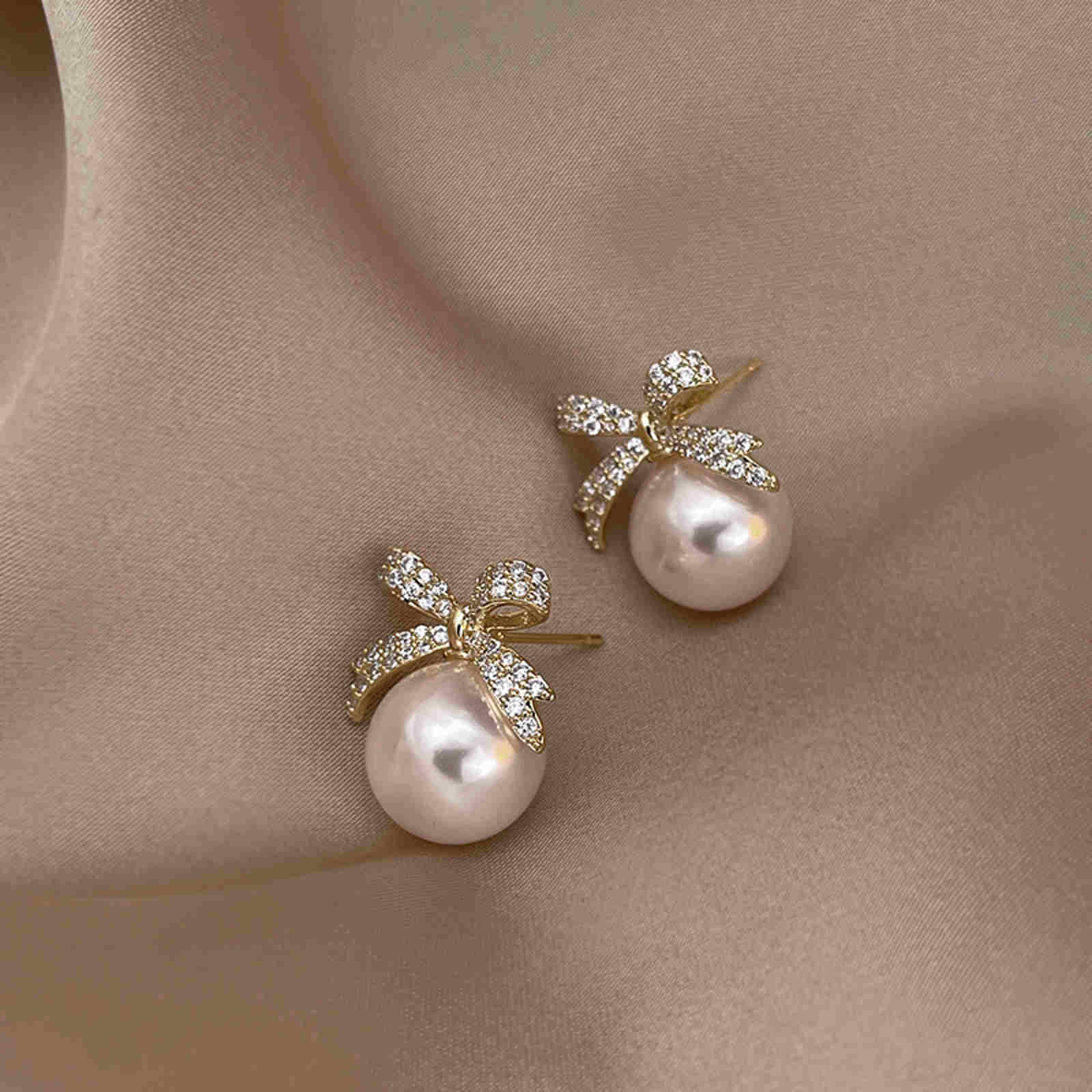 Pendientes de perlas con nudo de lazo Pendientes colgantes de perlas para niñas Pendientes de pajarita de cristal con pin plateado