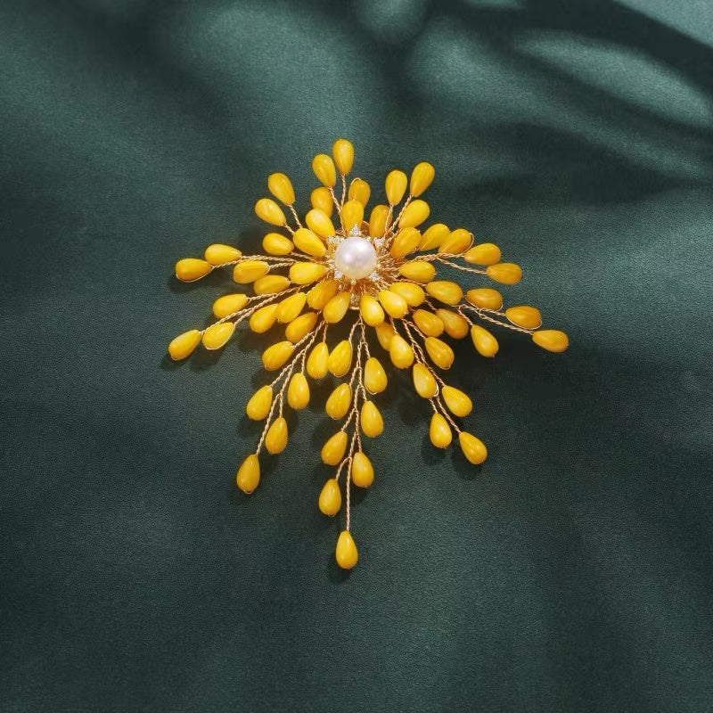 yellow brooch pin