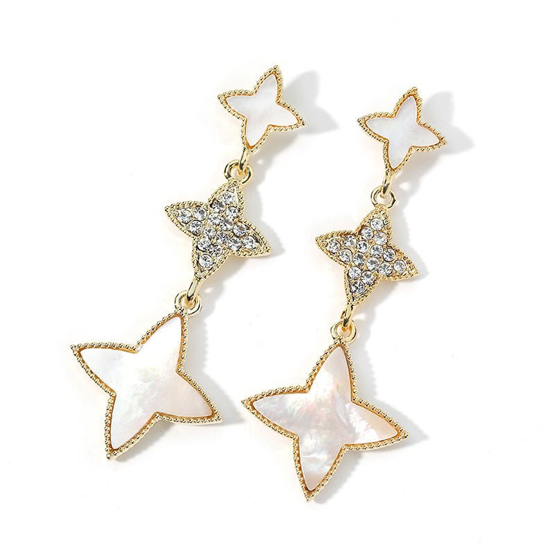Aretes de nácar en forma de estrellas en oro de 14 quilates y cristal