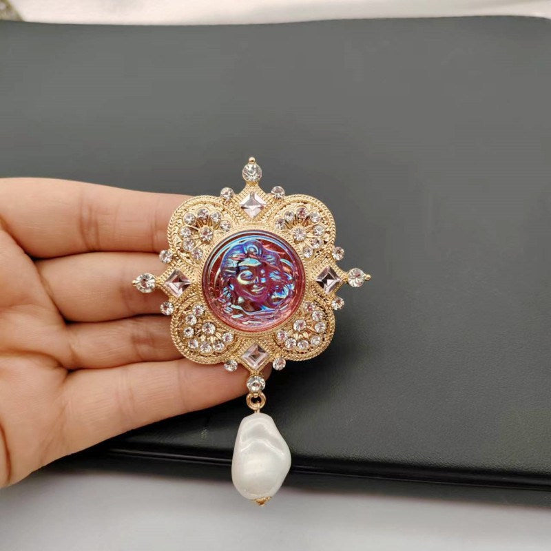 Broche de ángel único con gota de perla barroca