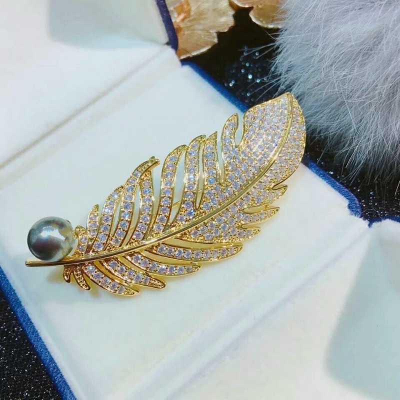 gold crystal feather brooch