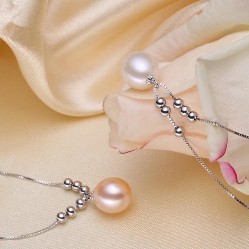 Collier avec pendentif en perle d'eau douce de culture et perles blanches avec chaîne en argent et or (7-8 mm)