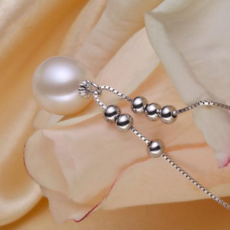 Collier avec pendentif en perle d'eau douce de culture et perles blanches avec chaîne en argent et or (7-8 mm)