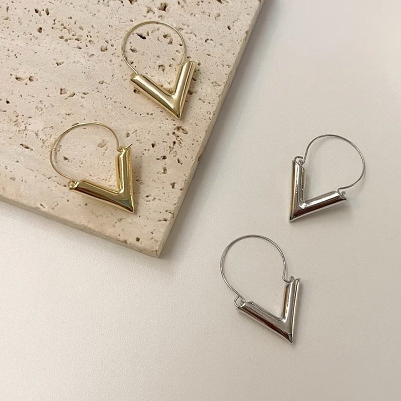 Silver 3D Yeah Triangle Huggie Earrings