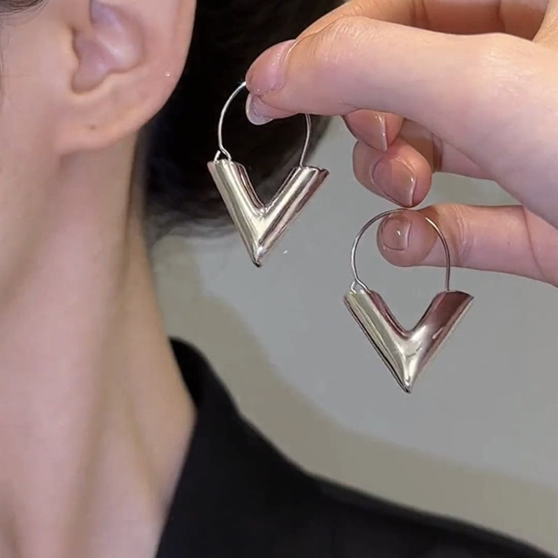 Silver 3D Yeah Triangle Huggie Earrings