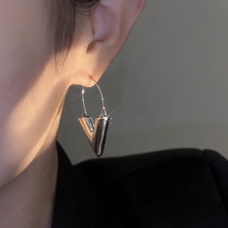 Silver 3D Yeah Triangle Huggie Earrings