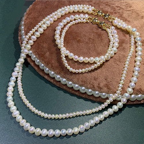 Doppelreihige Süßwasser-Zuchtperlenkette und Perlenarmband mit Goldfassung, Schmuckset 