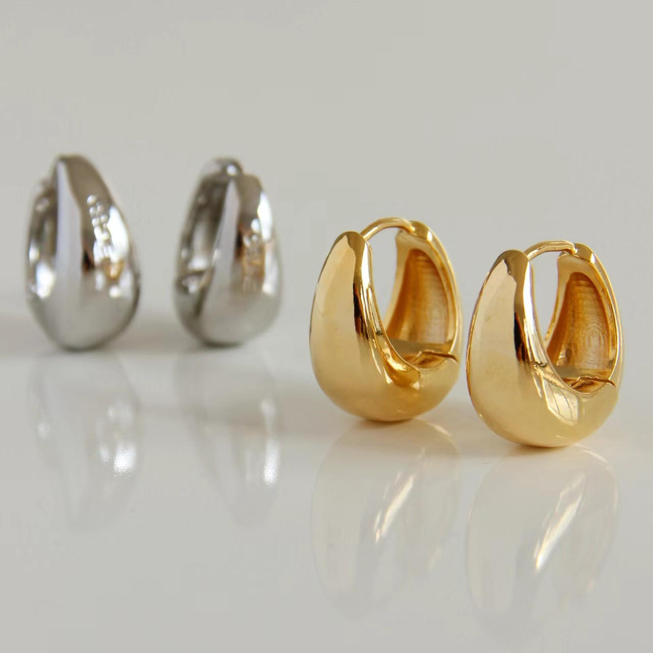 chunky hoop huggie earrings gold and silver