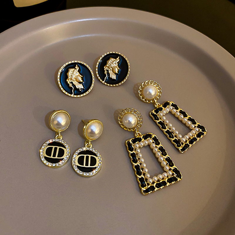 chanel gold and black earrings